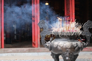 A temple to worship and incense burning honoring the gods at Hoan Kiem lake in Hanoi, Vietnam. 